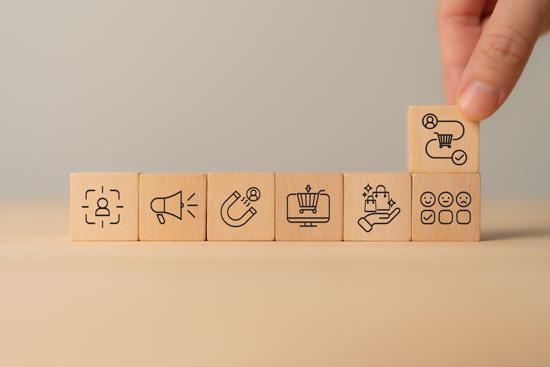 Customer Journey Concept. Wooden blocks with customer journey icons representing e-commerce, customer experience, marketing processes, online business, user engagement, and digital marketing strategy.
